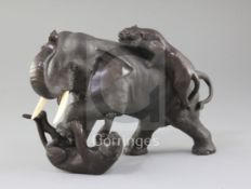 A Japanese bronze group of two tigers attacking an elephant, Meiji period, the elephant with