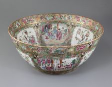 A Chinese famille rose bowl, 19th century, painted with figures amid pavilions and birds amid