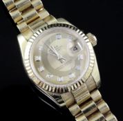 A lady's modern 18ct gold and diamond set Rolex Oyster Perpetual Datejust wrist watch, with