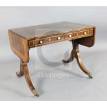 A Regency boxwood strung rosewood sofa table, with D shaped flaps and two frieze drawers with turned