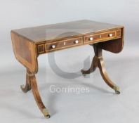 A Regency boxwood strung rosewood sofa table, with D shaped flaps and two frieze drawers with turned