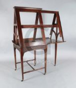 A late Victorian mahogany telescopic folio stand, with double flap top, the strapwork carved
