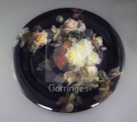 A Meissen porcelain charger, late 19th century, outside decorated with a study of roses on a