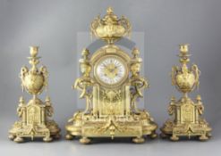 A 19th century French ormolu clock garniture, the architectural break arch case with applied foliate