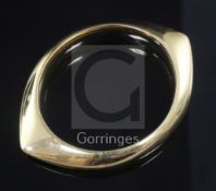 A Georg Jensen 18ct gold bangle, designed by Nanna & Jorgen Ditzel, no.1111, 74 grams.