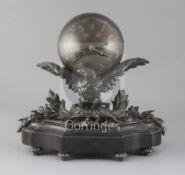 A 19th century French bronze mantel clock, modelled as an orb supported by an eagle on a black