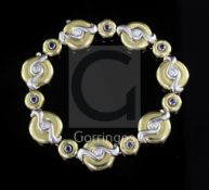 A Boodles & Dunthorne 18ct gold, sapphire and diamond graduated disc bracelet, signed "Boodles",