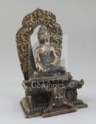 A Himalayan bronze seated figure of Buddha Shakyamuni, Qing dynasty, the figure seated on a lotus