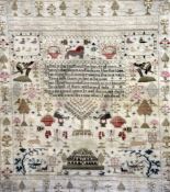 A George III needlework sampler, depicting gardens, birds, insects, a lion, stags and verse,