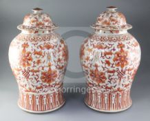 A pair of large Chinese iron red and gilt decorated baluster jars and cover, 19th century, each