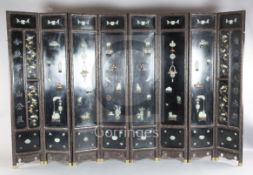 A good Chinese jade, hardstone and rosewood mounted eight fold Coromandel lacquer screen, 19th/
