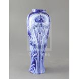 A Moorcroft Macintyre Florian ware tall baluster vase, in blue iris design, green signature W.