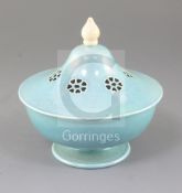 A Ruskin pottery pale blue souffle glazed bowl and cover the pierced cover with ivory finial,
