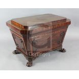 A late Regency mahogany large sarcophagus shaped wine cooler, with coffered and chamfered top