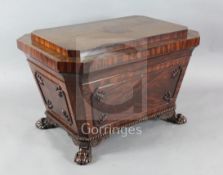 A late Regency mahogany large sarcophagus shaped wine cooler, with coffered and chamfered top