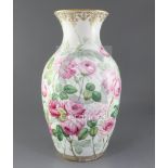 A large Minton bone china baluster vase, c.1850-60, finely painted with pink roses and leaves on a