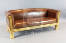 A David Linley tan leather settee, with parquetry frame, W.6ft D.2ft 6in. H.2ft 4in.