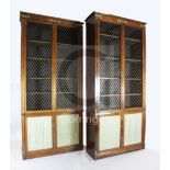 A suite of five Regency rosewood and brass mounted library bookcase cabinets, comprising a