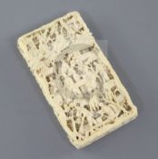 A Chinese export ivory card case, 19th century, carved in high relief with figures amid pavilions