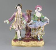 A Minton figure group candlestick. c.1840-5, modelled with a male and female dancer flanking a