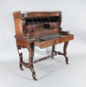 A George IV mahogany metamorphic writing desk, in the form of an upright pianoforte, with pierced