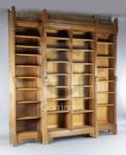 Attributed to A.W.N. Pugin. A mid 19th century Reformed Gothic oak breakfront open bookcase,