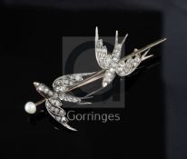 A Victorian gold, pearl and rose cut diamond set twin swallow bar brooch, with cabochon eyes, 57mm.