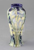 A Moorcroft Macintyre Florian ware small tapered vase, yellow iris design, signed in green W.M.