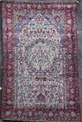 A Kashan silk prayer rug, woven in various colours with the Tree of Life on an ivory ground within a