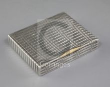 A 1940's Cartier silver cigarette case with 18ct gold thumbpiece, with geometric decoration and