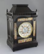 An Aesthetic movement ebonised architectural mantel clock, c.1885, the French movement striking on a