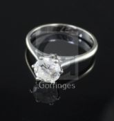 A modern 18ct white gold and solitaire diamond ring, the round brilliant cut stone weighing 1.27cts,