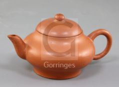 A small Chinese Yixing pottery teapot and cover, with ring shaped handle, impressed maker's mark
