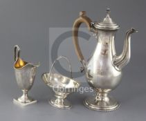An early 1970's 18th century style silver three piece coffee set by C.J. Vander Ltd, with vacant