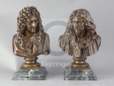 A pair of French bronze busts of Voltaire and Moliere, each on a shaped faux green marble base,