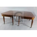 A George IV mahogany extending dining table, with rounded rectangular top, concertina action and