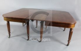 A George IV mahogany extending dining table, with rounded rectangular top, concertina action and