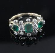 A Georgian gold and silver, three stone emerald and diamond half hoop triple cluster ring, with