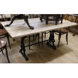 An Ash dining table with cast metal base 152 x 90cm