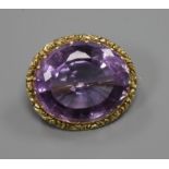 An early 20th century yellow metal mounted oval amethyst brooch, 26mm.ex Congelow House