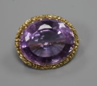 An early 20th century yellow metal mounted oval amethyst brooch, 26mm.ex Congelow House