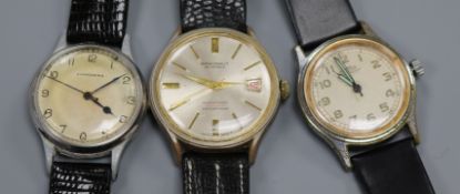 Three gentleman's assorted stainless steel wrist watches, including Longines and Roamer.