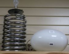 An Ingo Maurer chrome Spirale lamp with ovoid shade