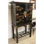 A Korean black lacquer drinks cabinet on stand W.94cm