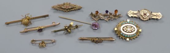 Eight Victorian and later 9ct gold and yellow metal brooches, a 15ct gold brooch and a stick pin.