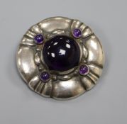 A Danish Georg Jensen sterling silver and amethyst cabochon set brooch, no 50, 40mm.