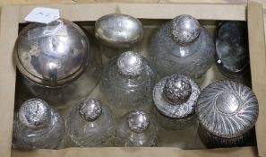 Nine assorted silver mounted scent bottles, dressing table jars etc. and a silver trinket box.