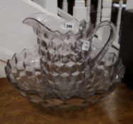 A facet cut glass jug and basin diameter 41.5cm