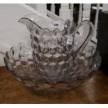 A facet cut glass jug and basin diameter 41.5cm