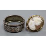 A Victorian carved shell cameo portrait brooch, gilt metal framed and a late Victorian silver bangle
